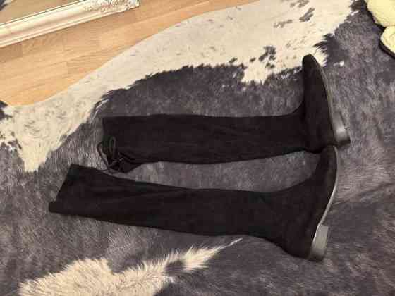 Mustat pitkät saappaat Kuopio