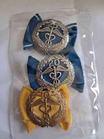 Ansiomerkit 2xhopea 1 pronssi Helsinki