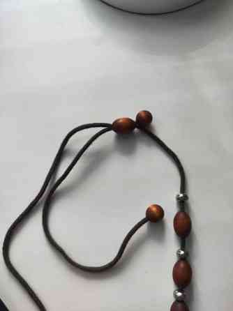 Puinen kaulakoru Нурмиярви