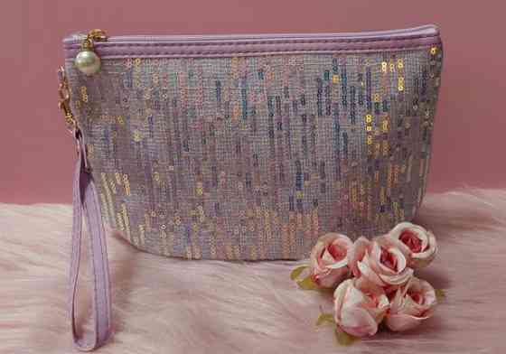 Paljetein koristeltu liila meikkilaukku Vantaa